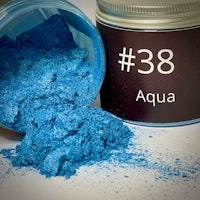 a jar with blue powder next to it