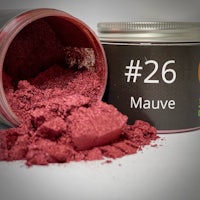 a jar of red powder with the word mauve on it