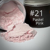 a jar with a pink powder next to it