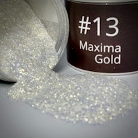 maxima gold glitter in a container next to a can