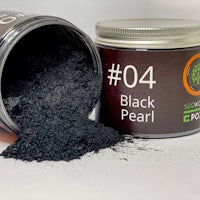 a tin of black pearl powder next to a jar