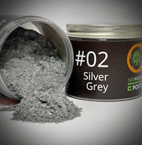 a tin of silver grey powder next to a jar