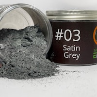 a tin of powder with the word'satin grey' on it