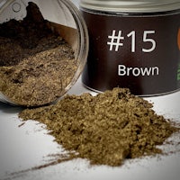 a jar with brown powder next to it