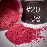 a can of red wine powder next to a can