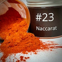 a jar of nacarat powder next to it