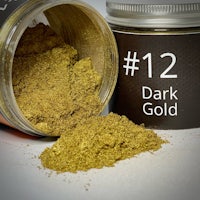 a jar of dark gold powder next to a jar